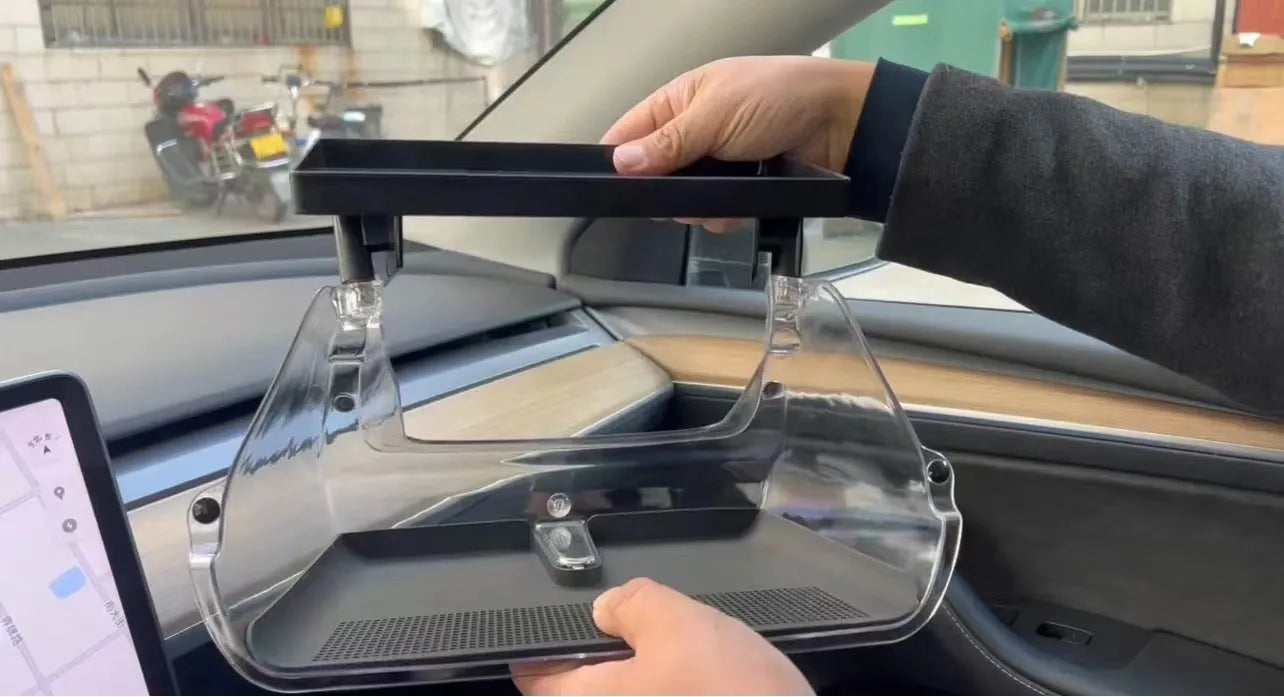 Black ABS storage box placed under Tesla Model 3 centre screen