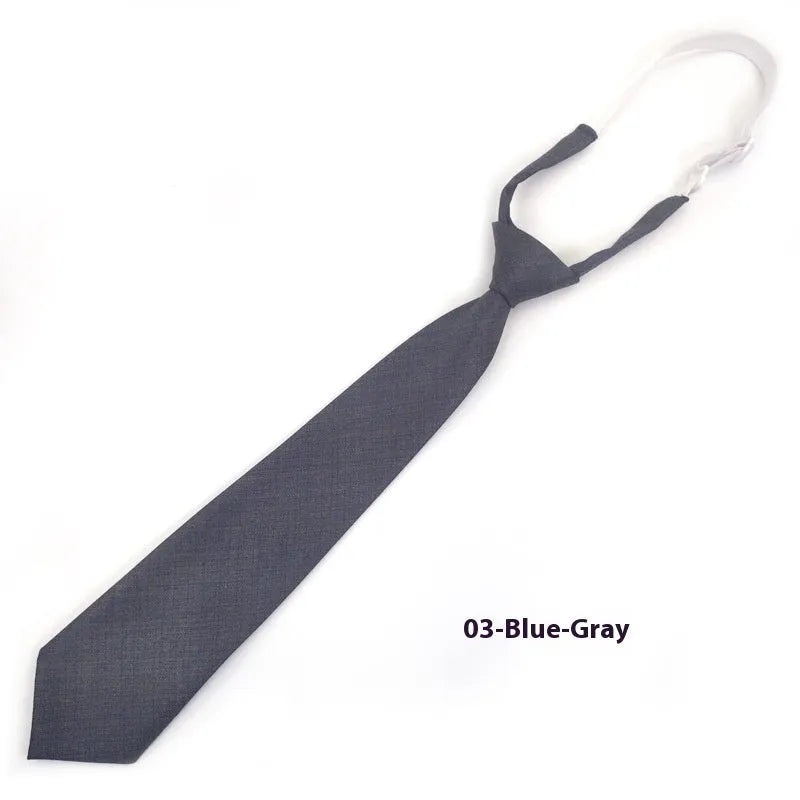 Navy blue cotton bow tie with arrow style design measuring 35cm by 7cm