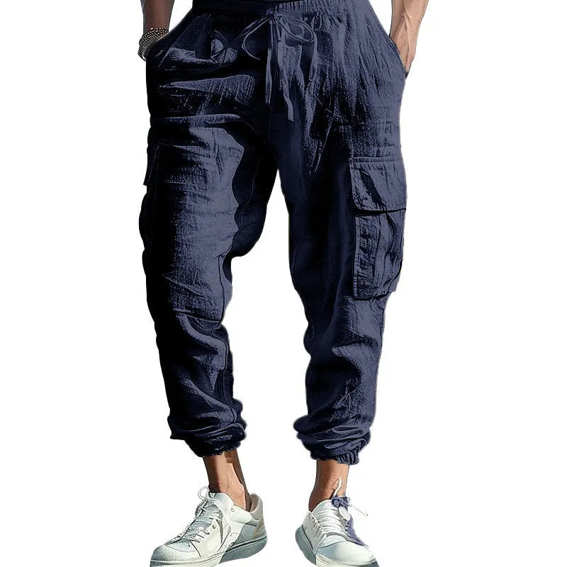 Men's loose fit linen casual trousers with ankle-tied tether and multiple pockets in an earthy colour.