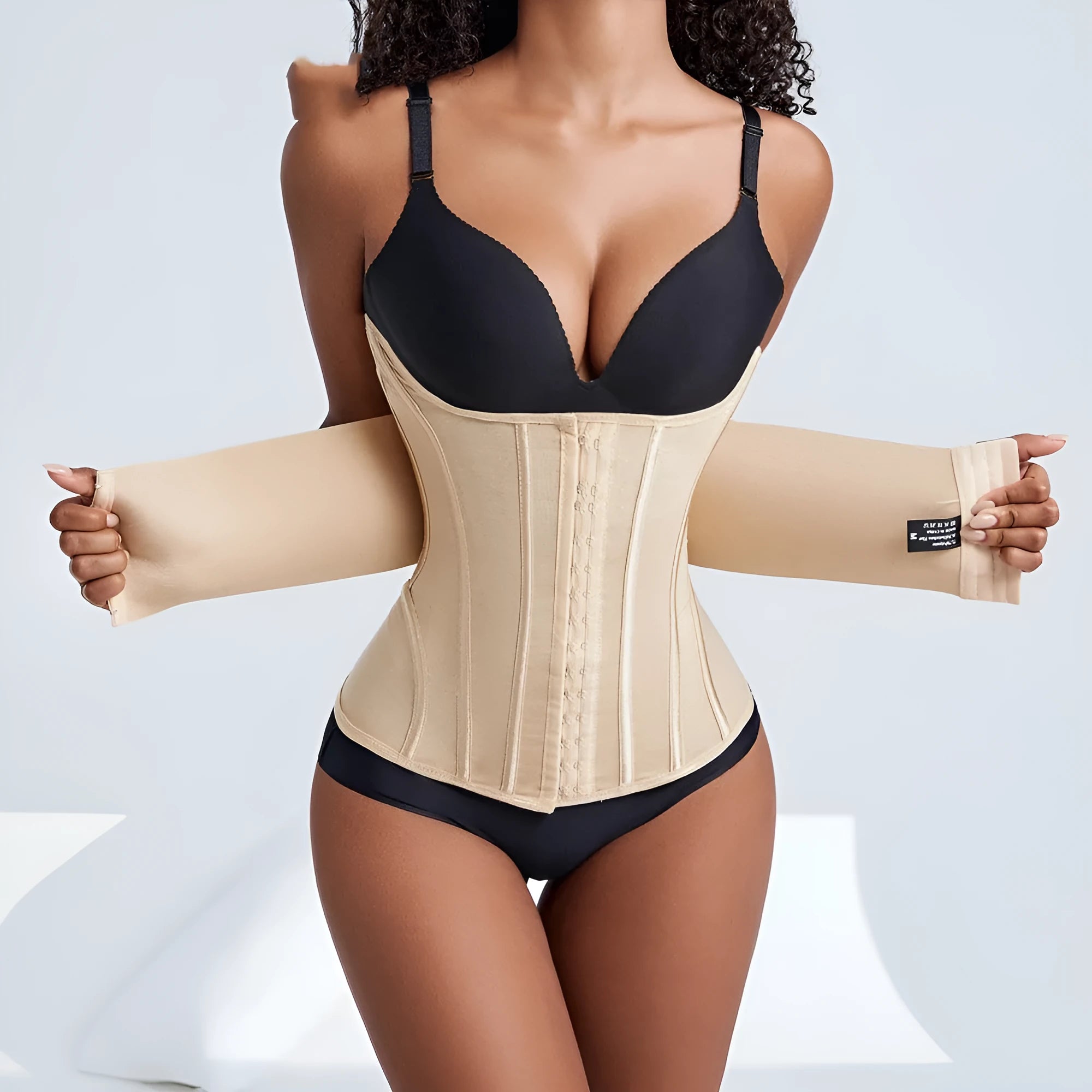 Nylon belly band waist trainer in black or apricot colour with belt tie closure
