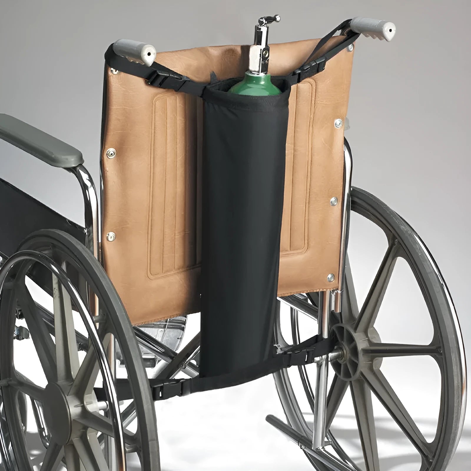 Black cylindrical oxford cloth pannier bag for securing an oxygen cylinder to a wheelchair.