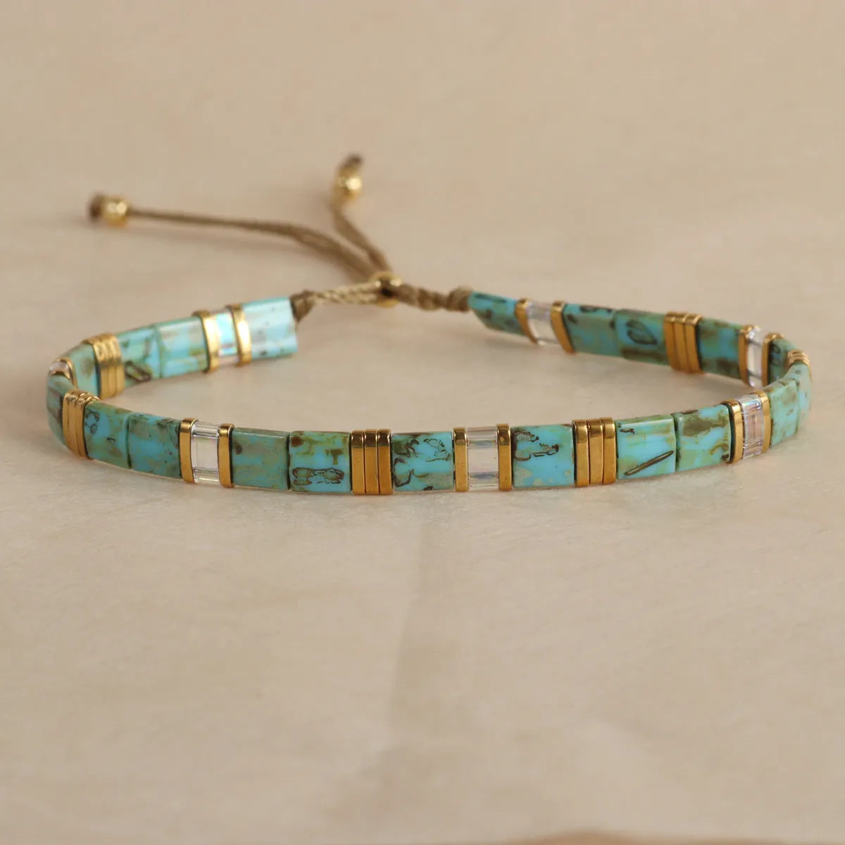 Geometric glass bead bracelet in round design with coloured glaze accents