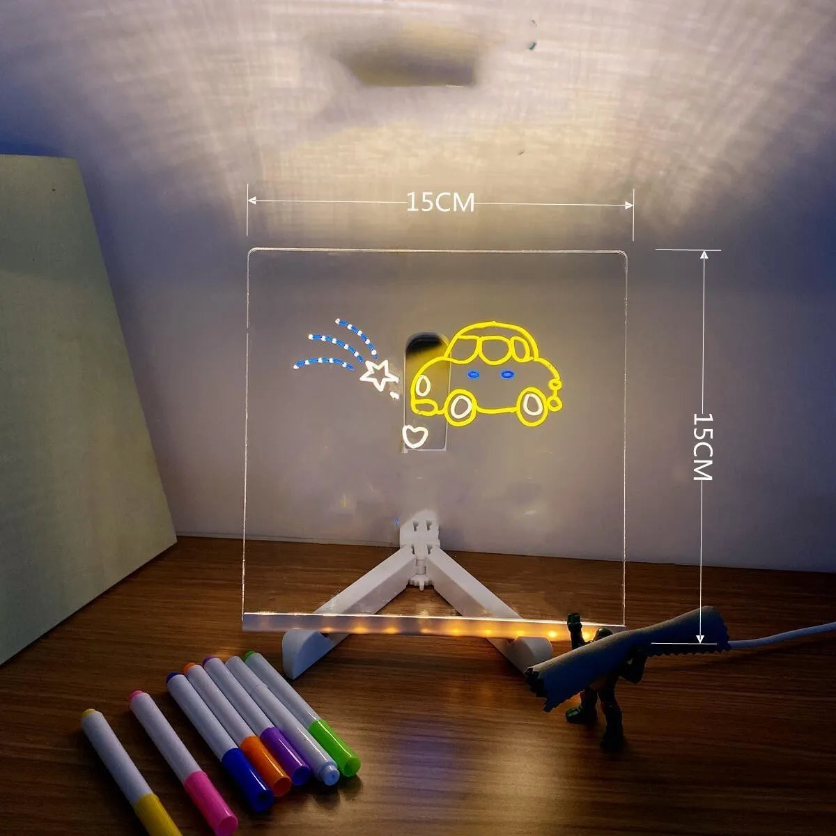 Acrylic DIY note board LED night light with pens on desk, showing written message and soft glow