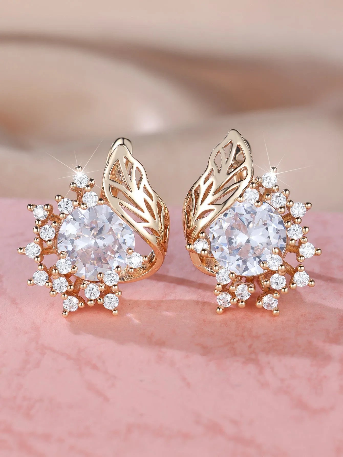 Round flower feather earrings with zircon stones in champagne gold finish, showing six colour variations