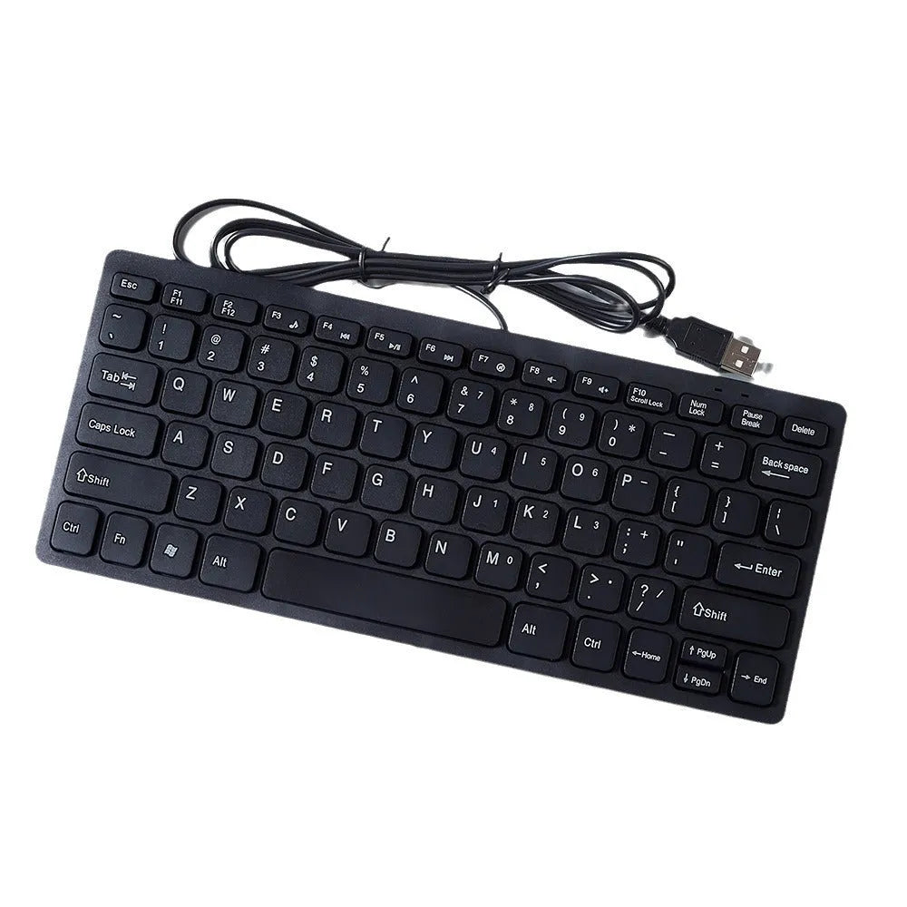 Compact wired USB mini keyboard in black, white, pink, or blue colours on a desk.