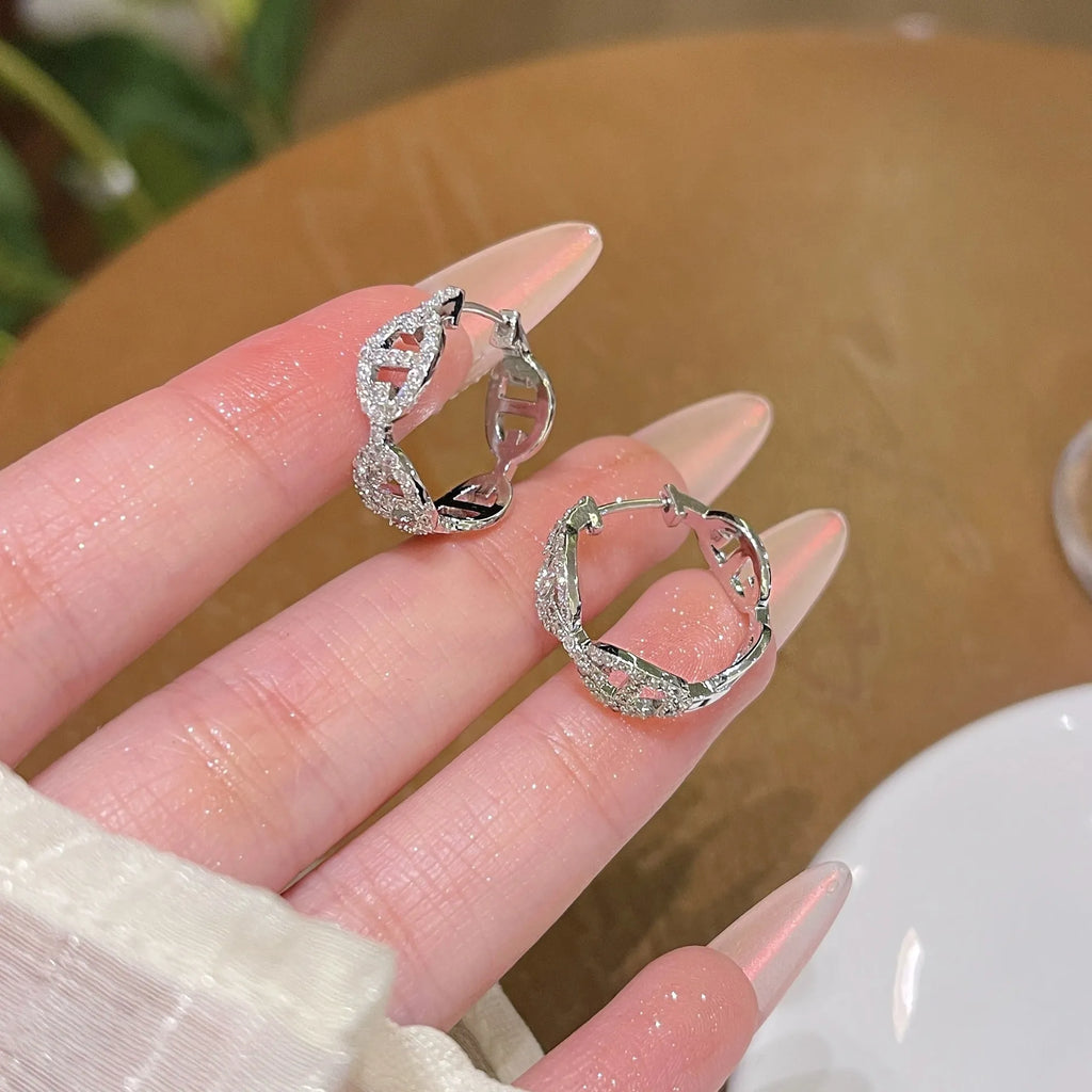 Women's thick gold plated diamond earrings in silver, gold and rose gold colours on copper base with electroplated finish