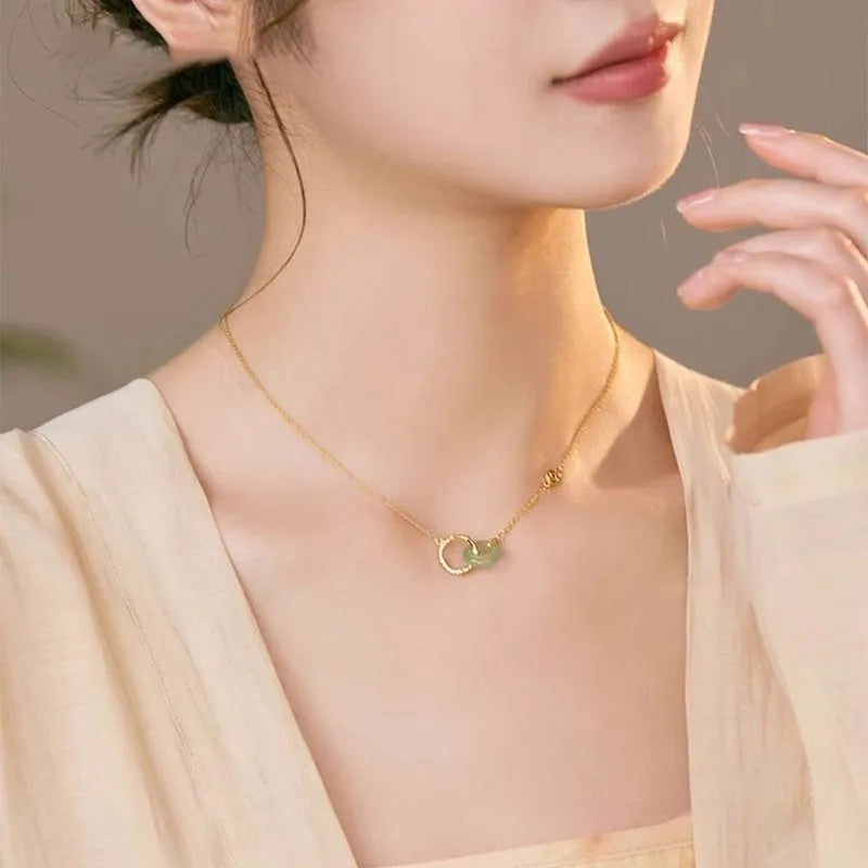 Handmade S925 sterling silver bamboo joint peace buckle necklace with pearl element on adjustable O-ring chain against neutral background