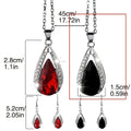 Teardrop pendant necklace and matching earrings set in black or red alloy with water droplet design elements