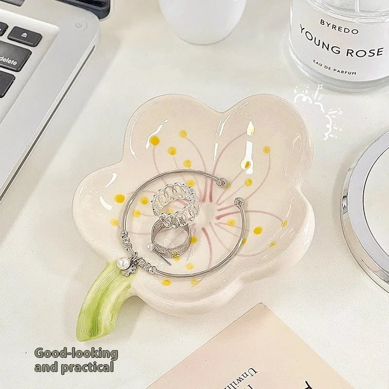 White porcelain girls ornament tray with small night light, shown in yellow and pink shell options.