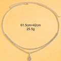 Gold water drop pendant waist chain with sparkling rhinestone tassel and lobster buckle.
