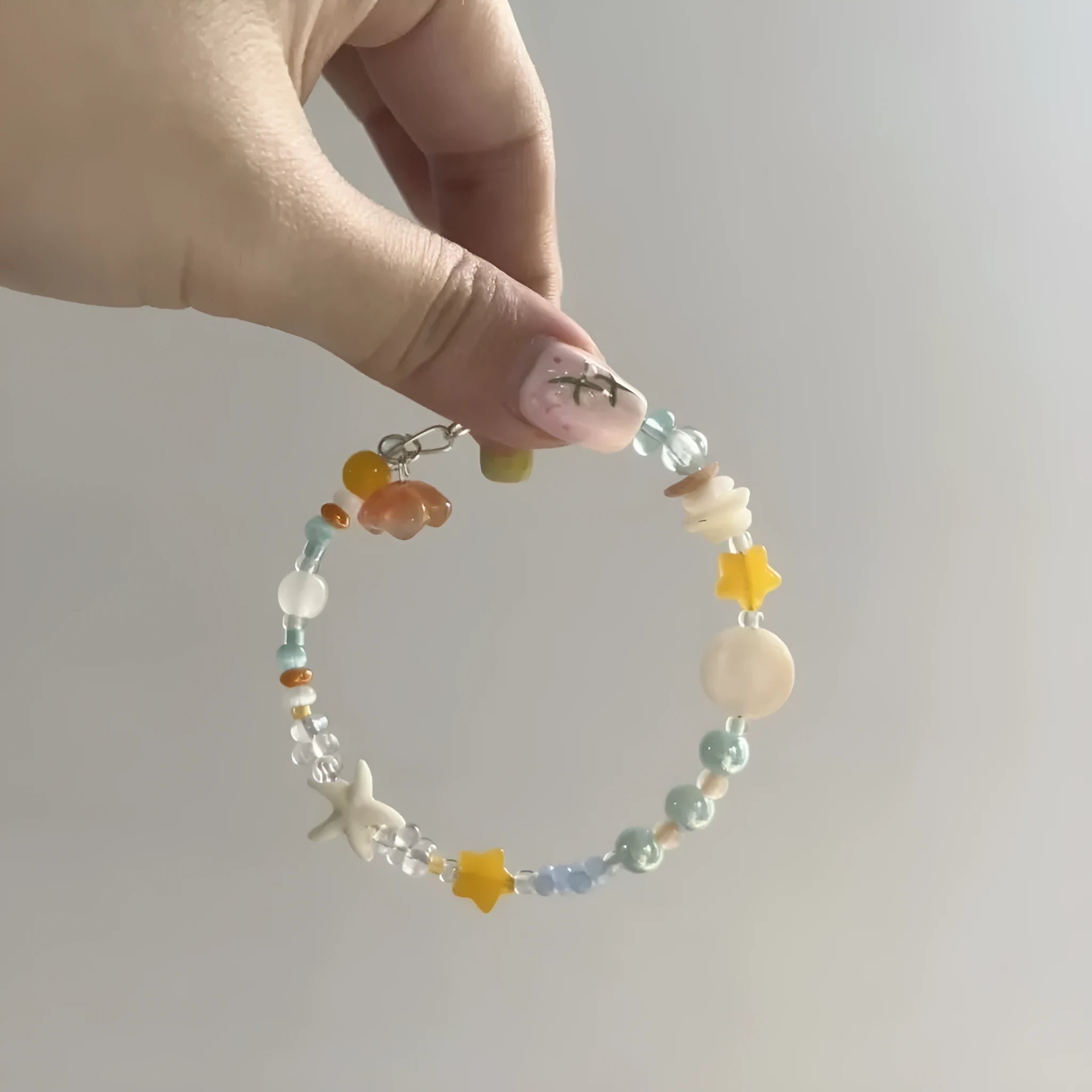 Orange alloy bracelet with diamond shape and round decorative elements for women's summer fashion
