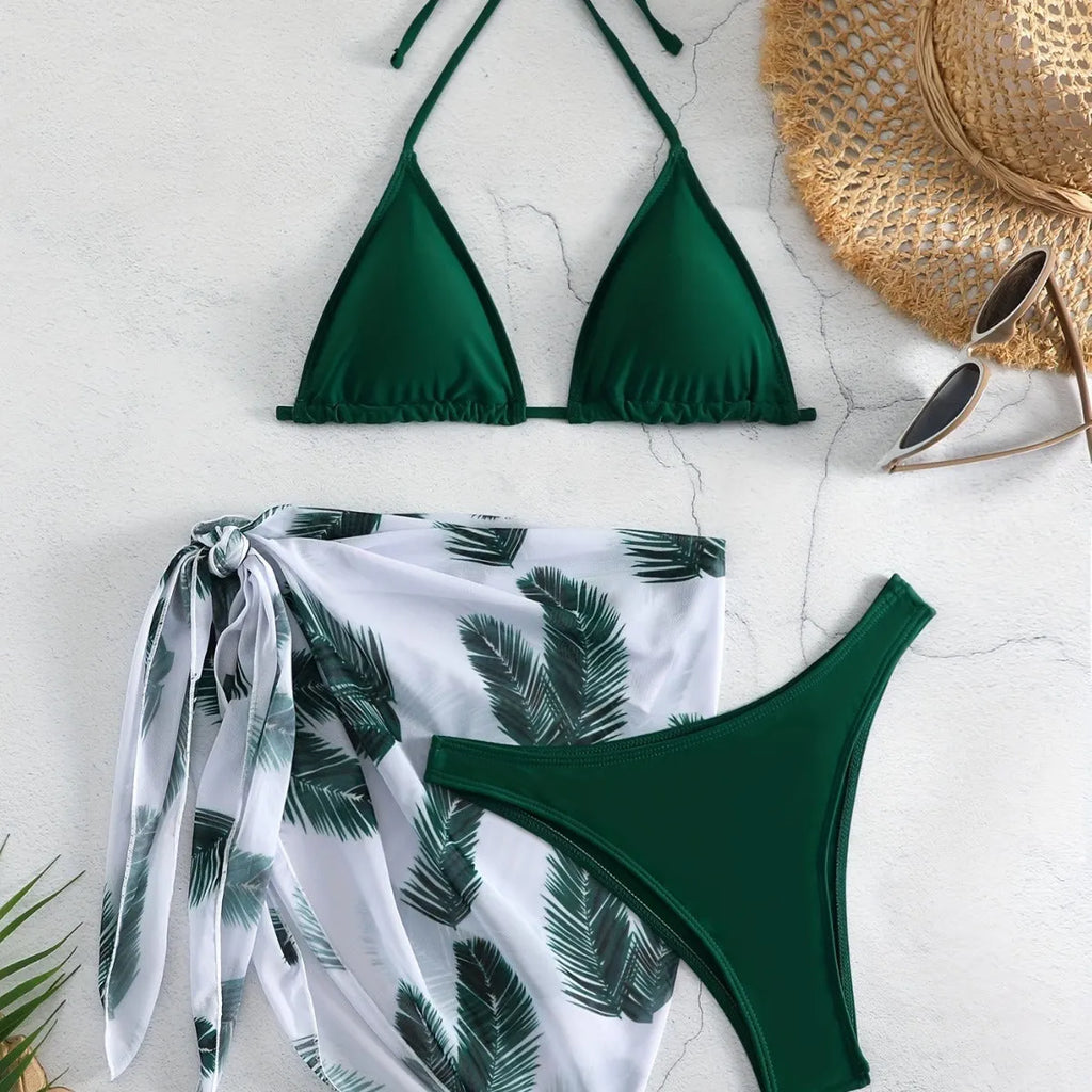 Three-piece bikini swimsuit set with printed gauze skirt in solid colour polyester, available in eight colours sizes XS to XL