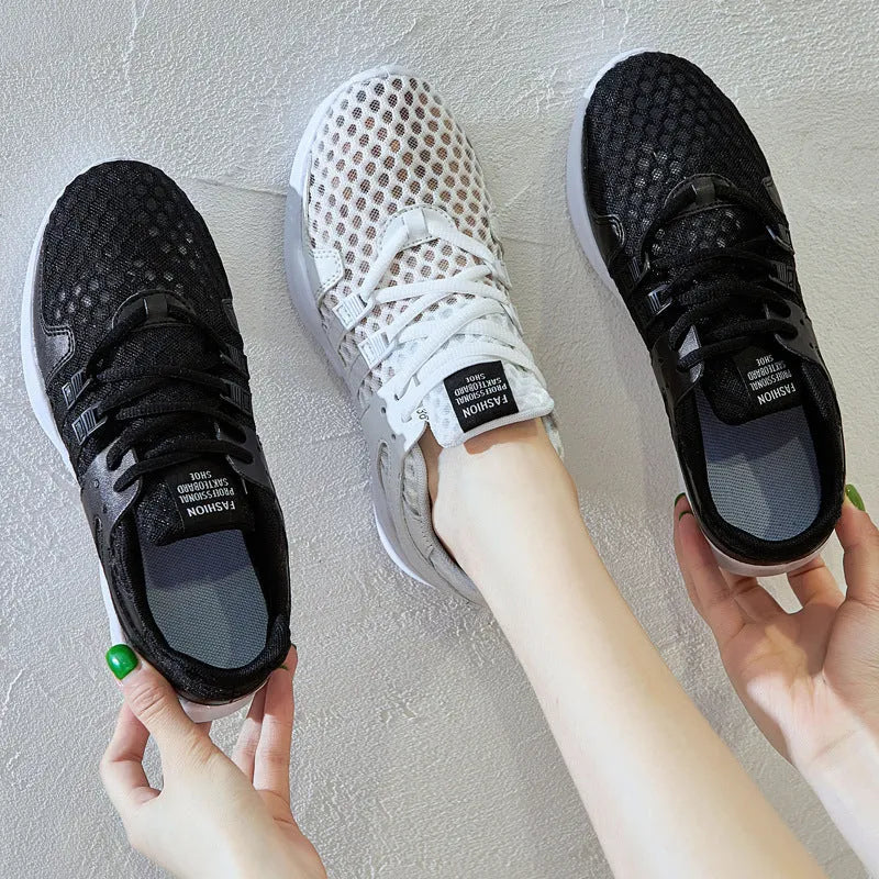 Low-top mesh sneaker with hollow breathable design and round toe in black and white colour options