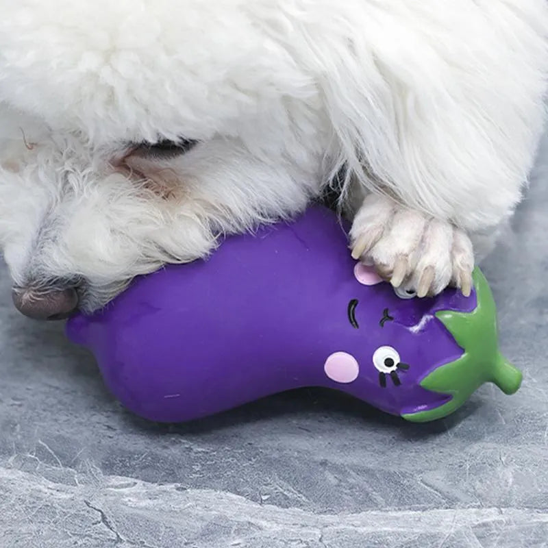 Green cartoon onion-shaped latex dog chew toy on white background