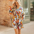 Orange floral print women's dress with striped lace sleeves and hem, V-neck long sleeve design.