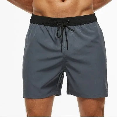 Men's blue running shorts with a drawstring waistband and a side headband pocket.