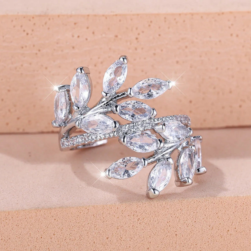 Adjustable copper leaf ring with zircon stones in various colour settings including platinum and rose gold options