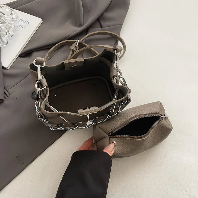Soft PU retro bucket bag with chain detail on woman's shoulder