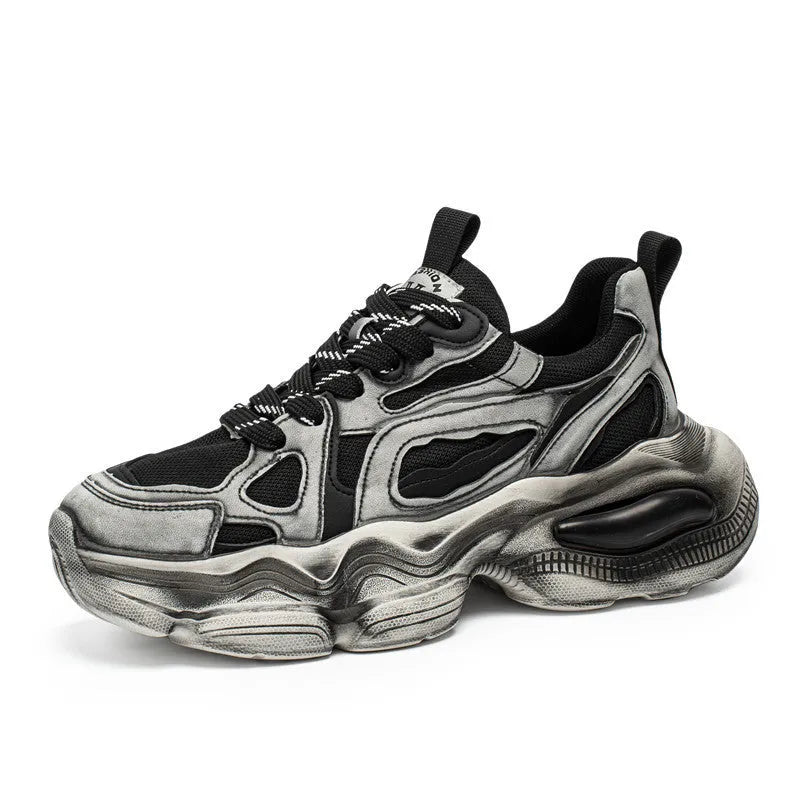 Men's black mesh sneakers with a platform sole and front lace-up closure on a white background.
