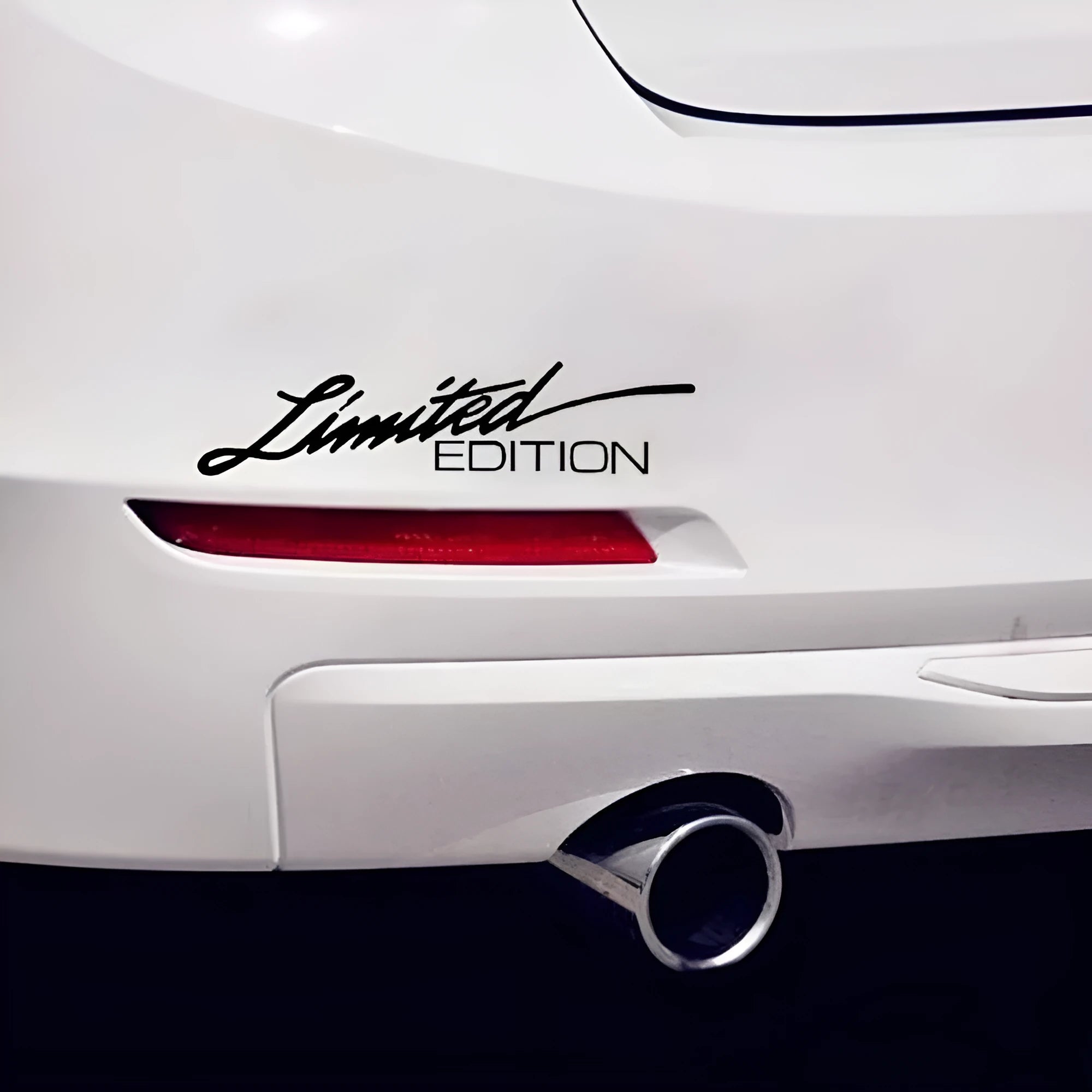 Reflective plastic bumper sticker in British style, showing black, white and colourful options next to a 16cm ruler.