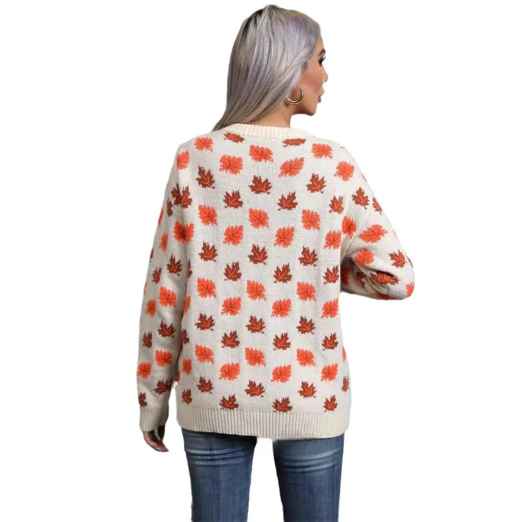 Women's beige loose fit polyester sweater with maple leaf contrast colour pattern and round neck