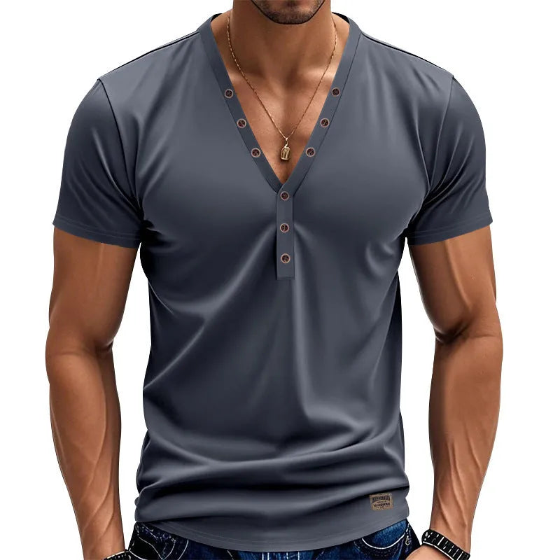 Man wearing a loose grey V-neck T-shirt with button detail on the front.