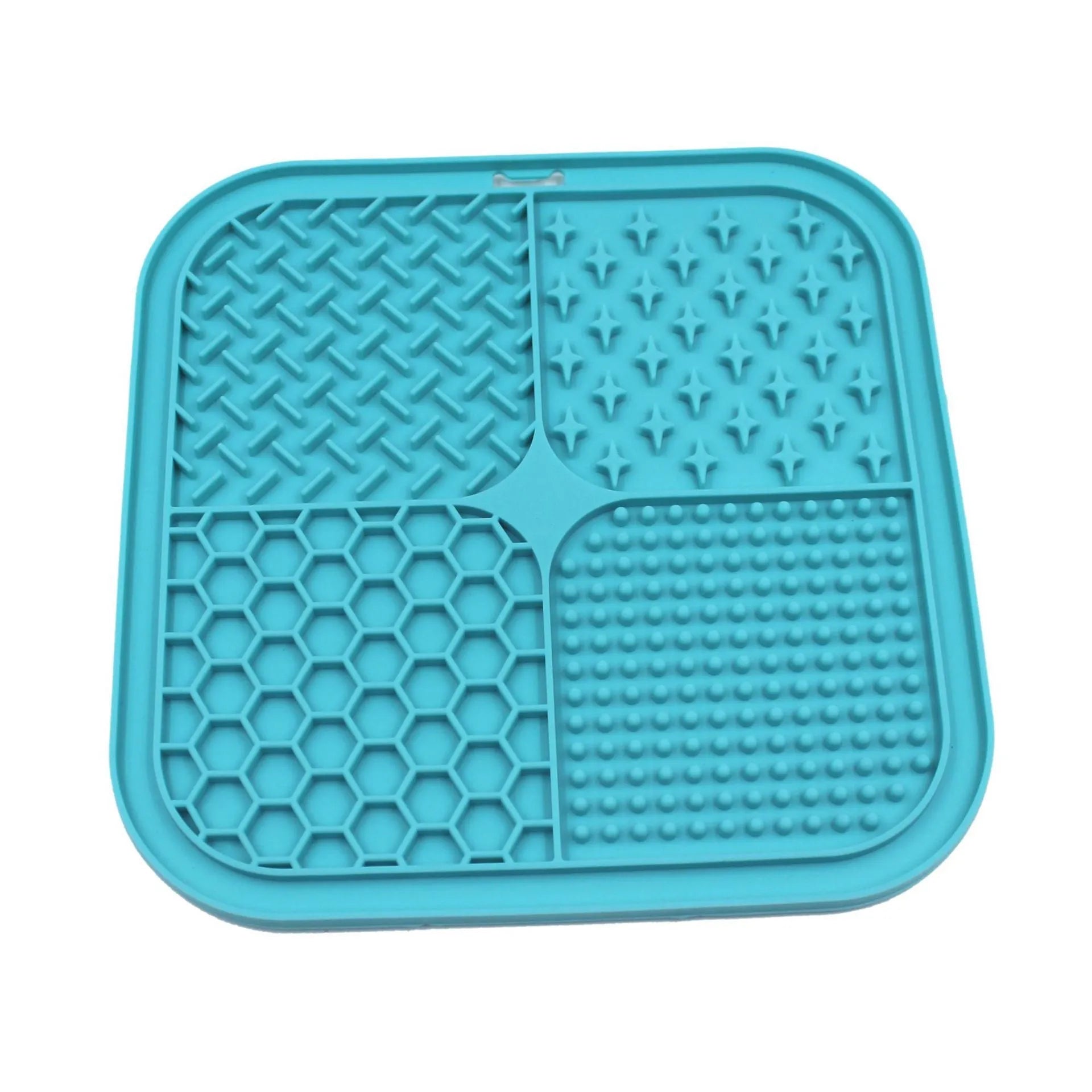 Green silicone pet licking pad 20x20cm with suction cup base on a tiled floor