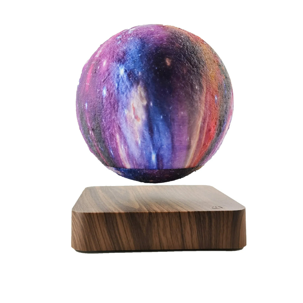Magnetic levitation galaxy moon lamp floating above walnut-coloured base with starry light projection