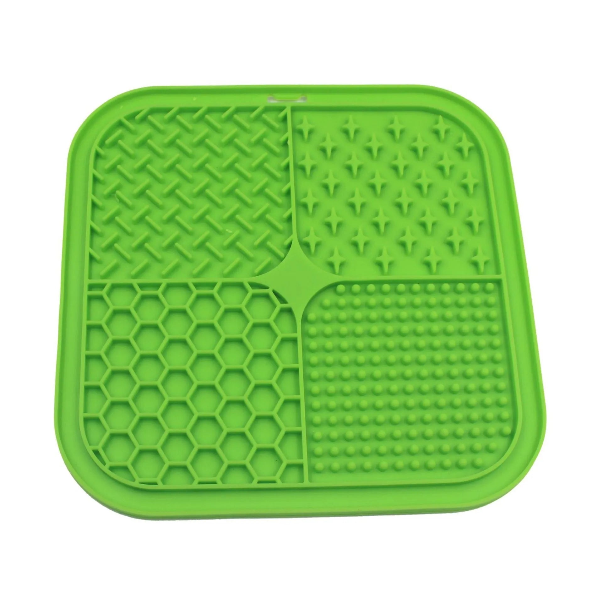 Green silicone pet licking pad 20x20cm with suction cup base on a tiled floor