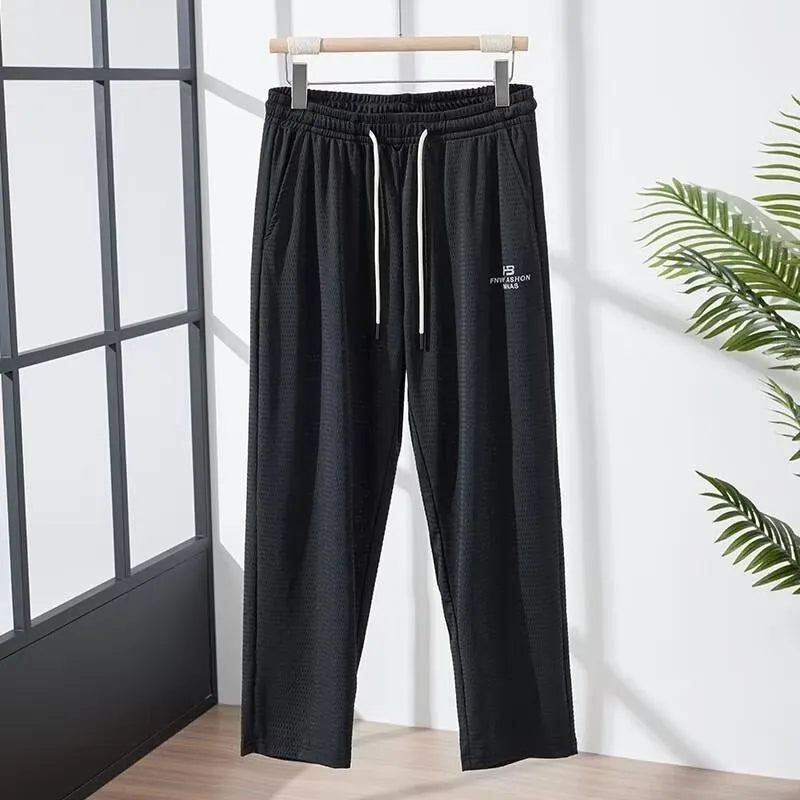 Men's ice silk thin breathable quick-drying casual pants in solid colour with drawstring high waist