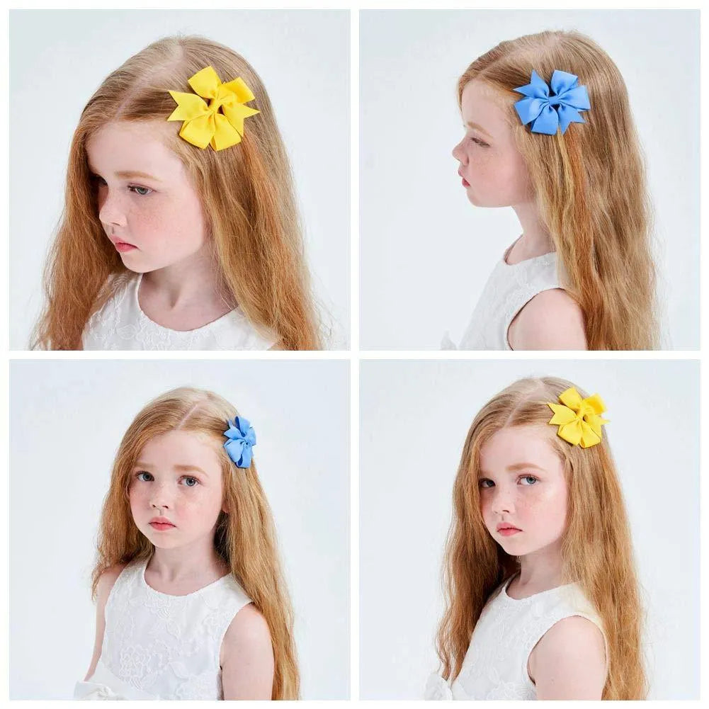 Grosgrain ribbon pinwheel hair bow 3 inches with alligator clip on light background