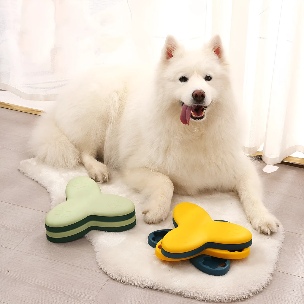 Yellow spinning dog slow food toy carousel on a light background, 24.5cm plastic interactive feeder