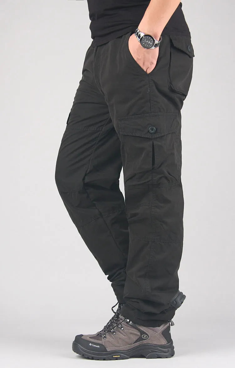 Men's stone-washed khaki cotton work overalls with a wool lining, shown with a loose straight-leg fit.