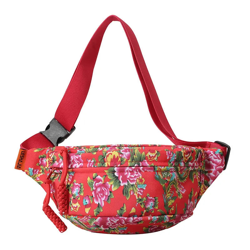 Women's nylon waist bag with big floral pattern, contrast stitching, and three-dimensional outer pocket in black