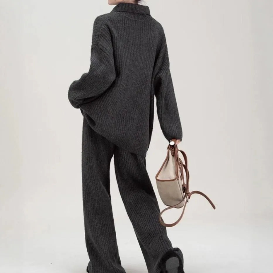 Women's beige imitation cashmere knitted sweater top and matching trousers two-piece set.