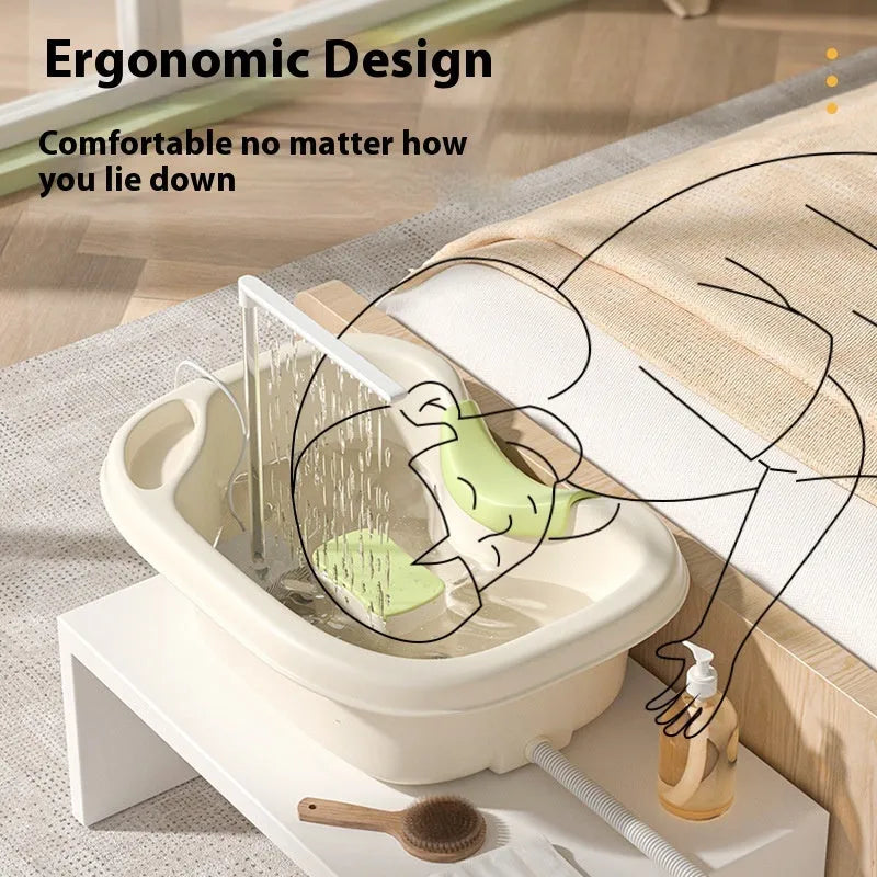 Portable plastic bed shampoo basin set with head pillow, water pump, and accessories in light pink colour.