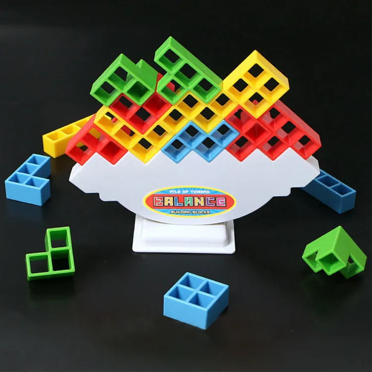 Plastic balance stacking game with 16 coloured blocks, chassis and base for family travel parties