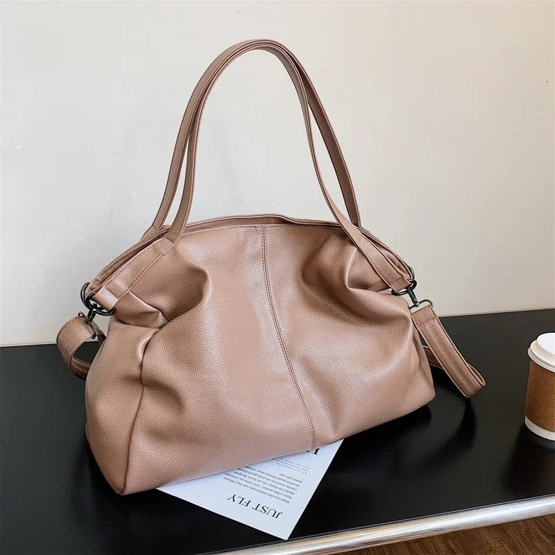 Large soft surface messenger bag with zip opening and adjustable shoulder strap in four colour options