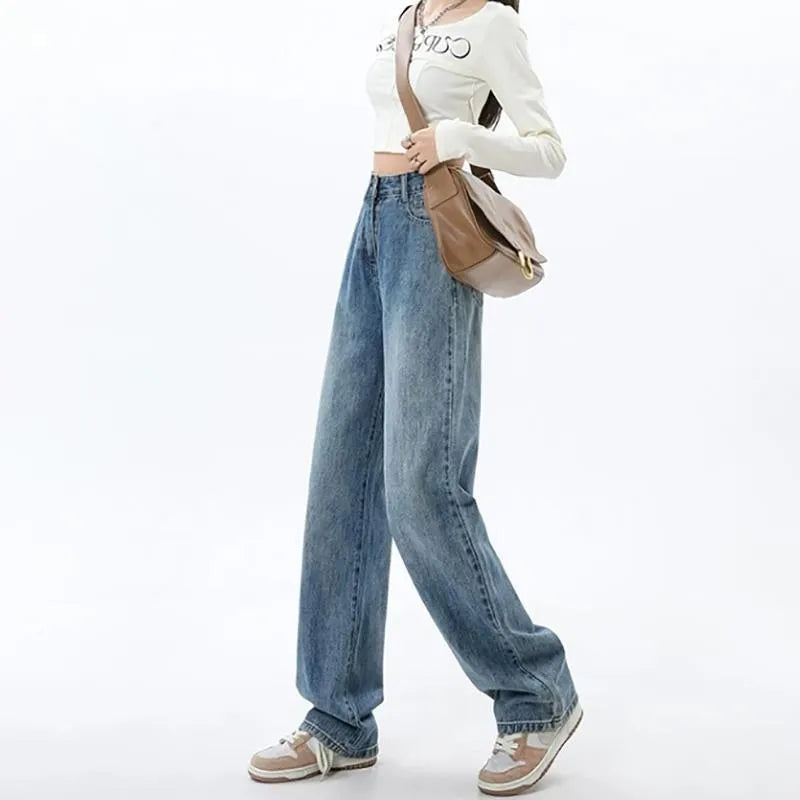 Women's retro blue wide leg jeans with high waist and straight leg design on denim background