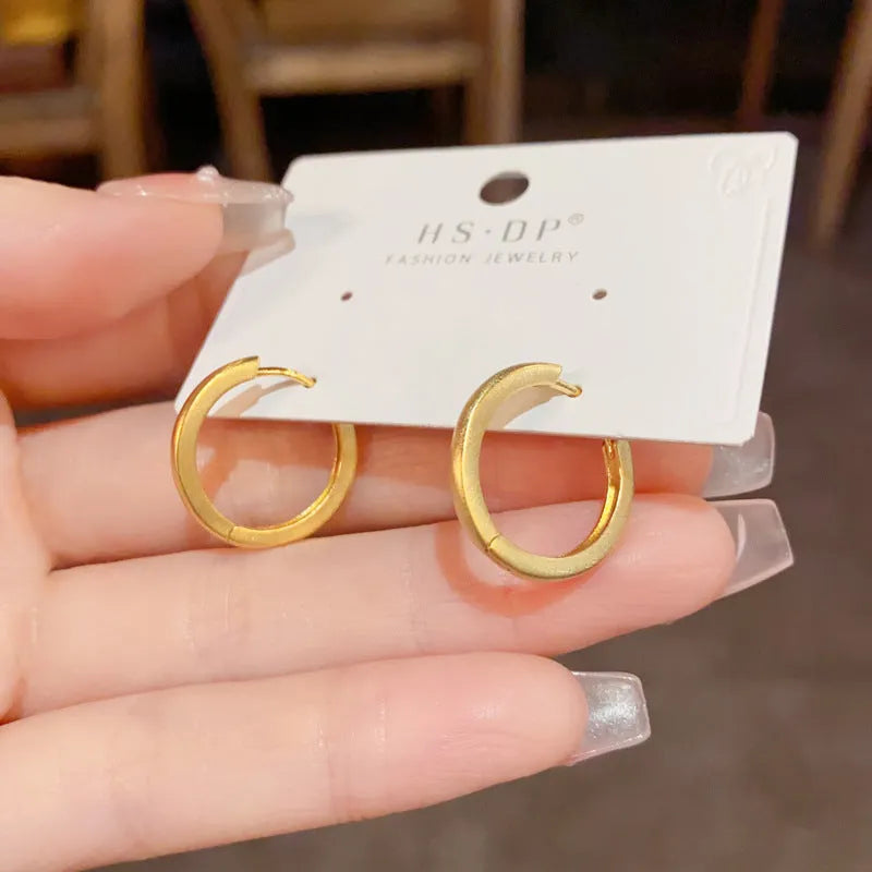 Geometric copper ear clip with real gold plating in simple women's jewellery design