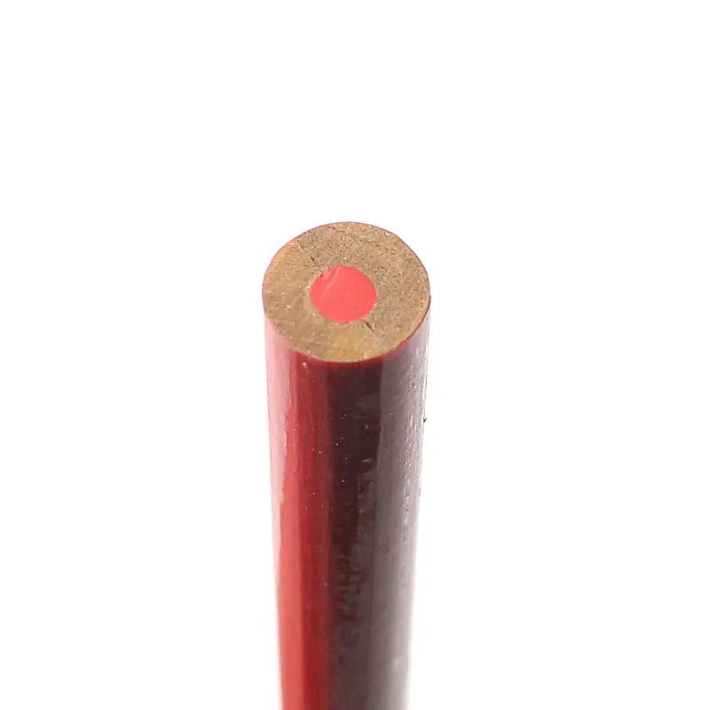 Ten red and blue round wooden carpenter pencils for marking, laid out on a work surface.