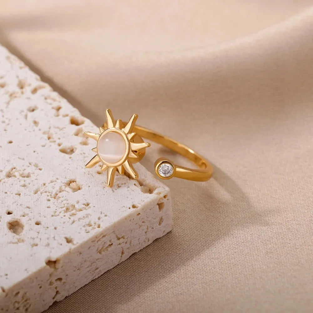 Simple geometric copper ring with adjustable opening and rotating mechanism in gold colour.
