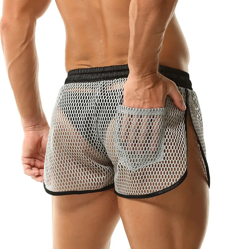 Men's loose breathable polyester boxers in solid colour, black, front view on plain background
