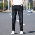 Thin stretch cotton denim trousers in black, tapered business casual style with belt loops and front pockets