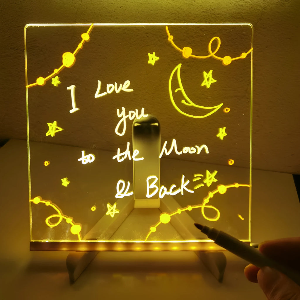 Acrylic DIY note board LED night light with pens on desk, showing written message and soft glow