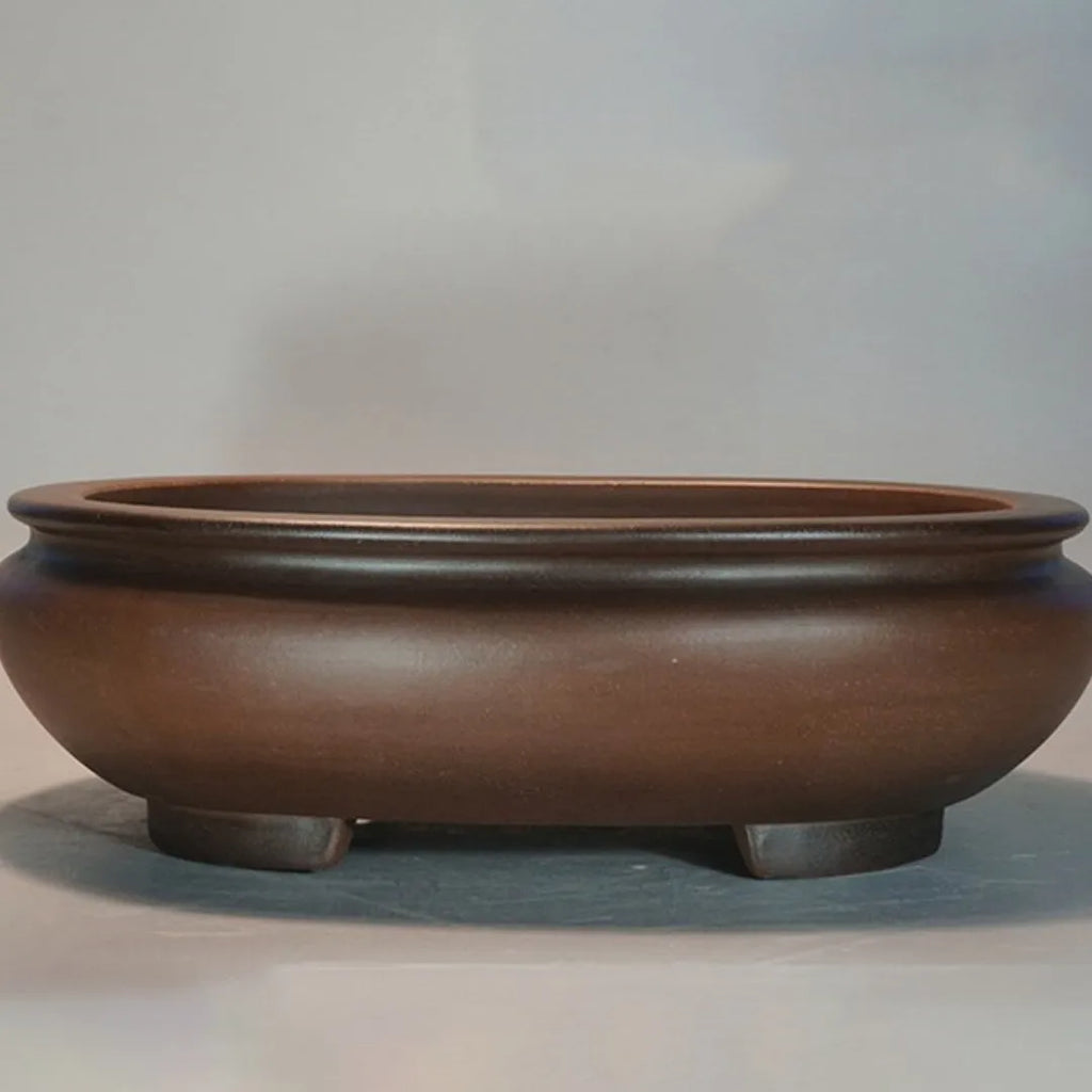 Handmade classical purple clay flowerpot for indoor desktop use.