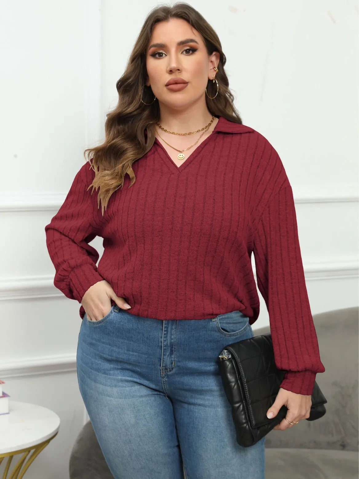 Women's plus size grey polar fleece shirt with a polo collar and lantern sleeves.