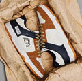 Casual lace-up sneakers in plain style with youth fashion design