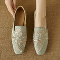 Women's embroidery low-cut flat pump in black, round toe with cloth upper and pigskin lining