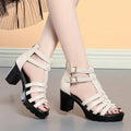 Summer hollow-out high heel shoes with rhinestone detailing, fish mouth toe, and buckle closure in beige